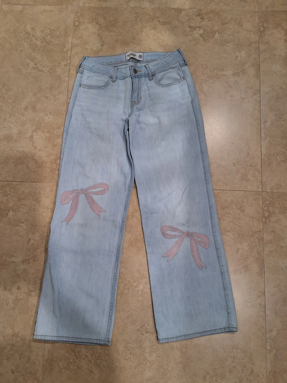 abercrombie kids light blue skinny jeans with tan stitching